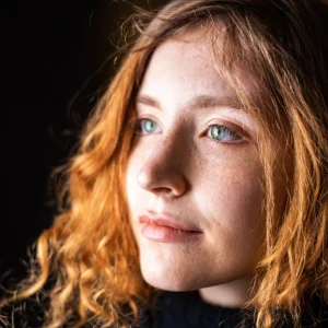 portrait-young-girl-with-ginger-hair-green-eyes-freckles
